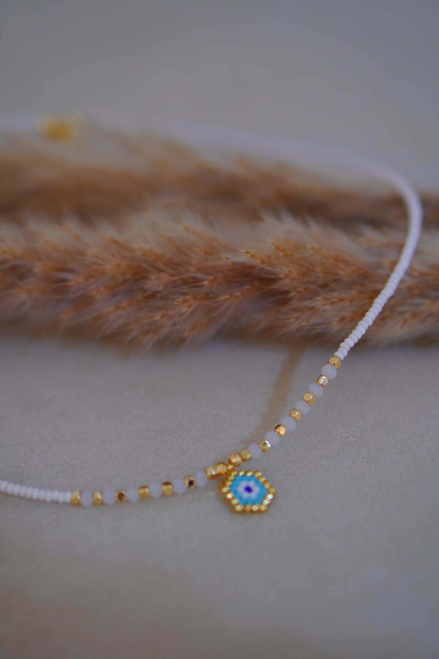 Perlenkette mit blauem Auge